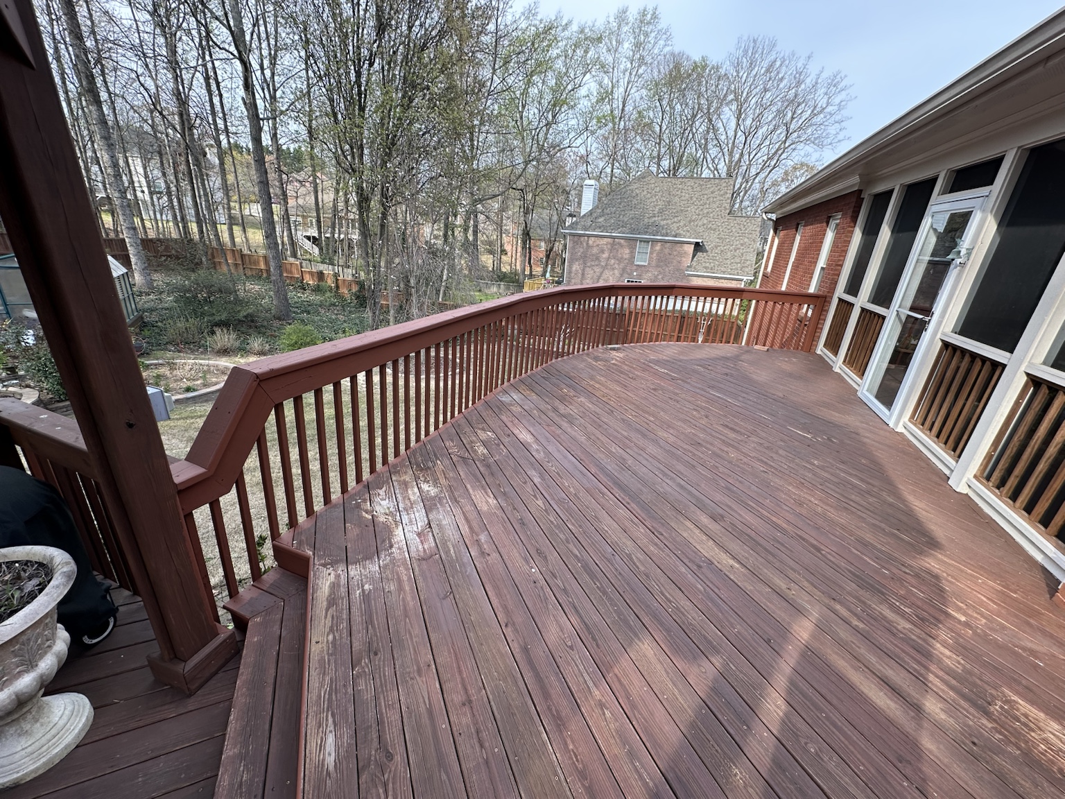 Residential deck and exterior before renovation — view 10