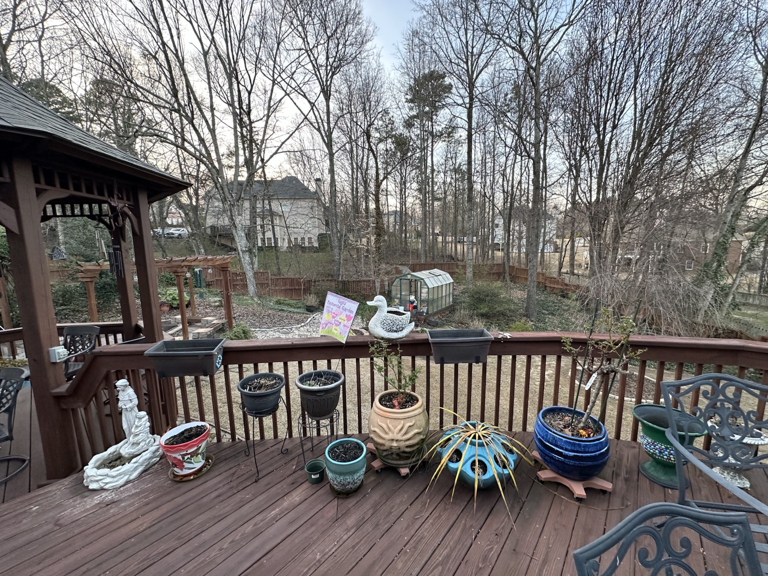 Residential deck and exterior before renovation — view 2