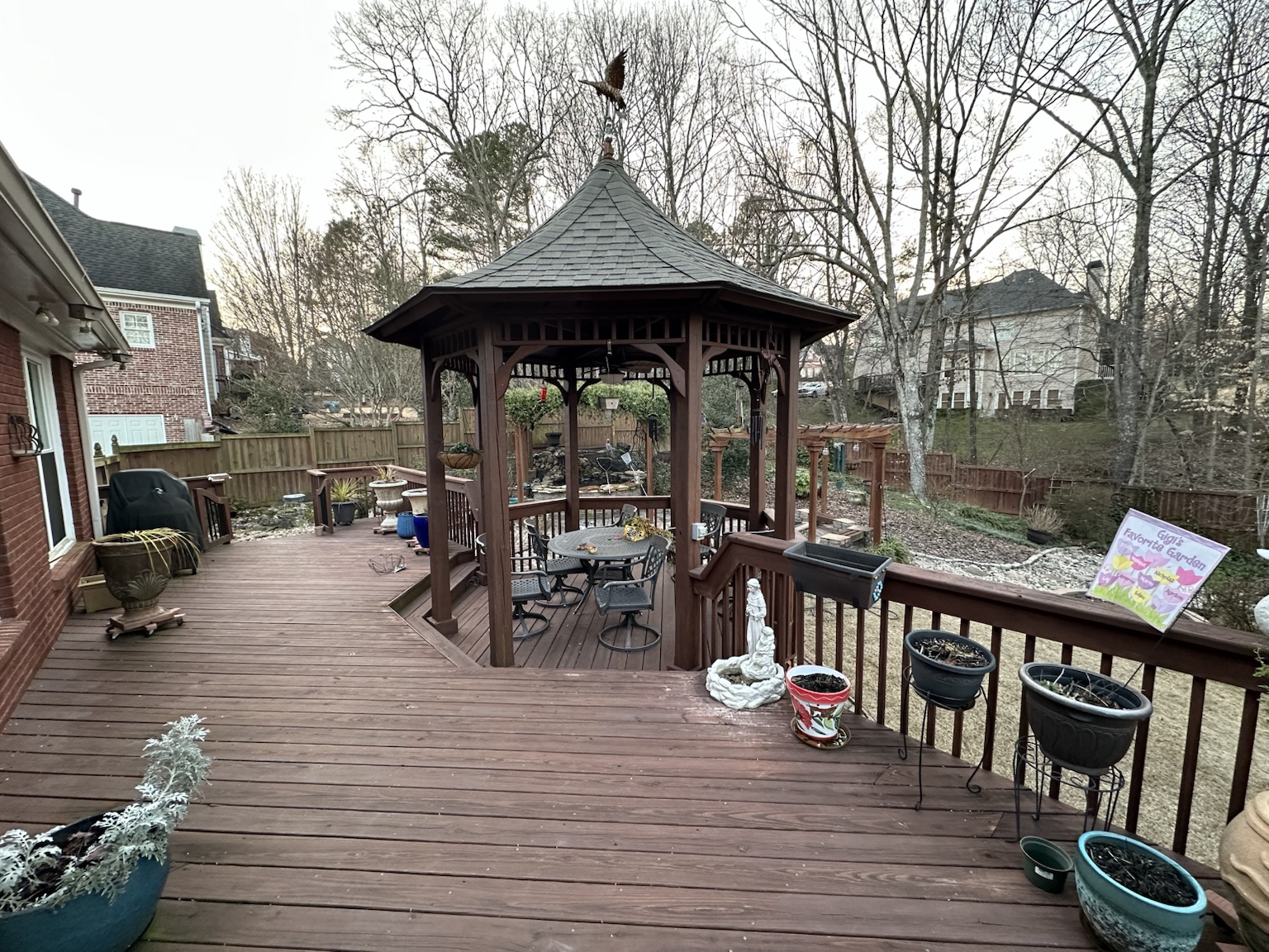 Residential deck and exterior before renovation — view 3