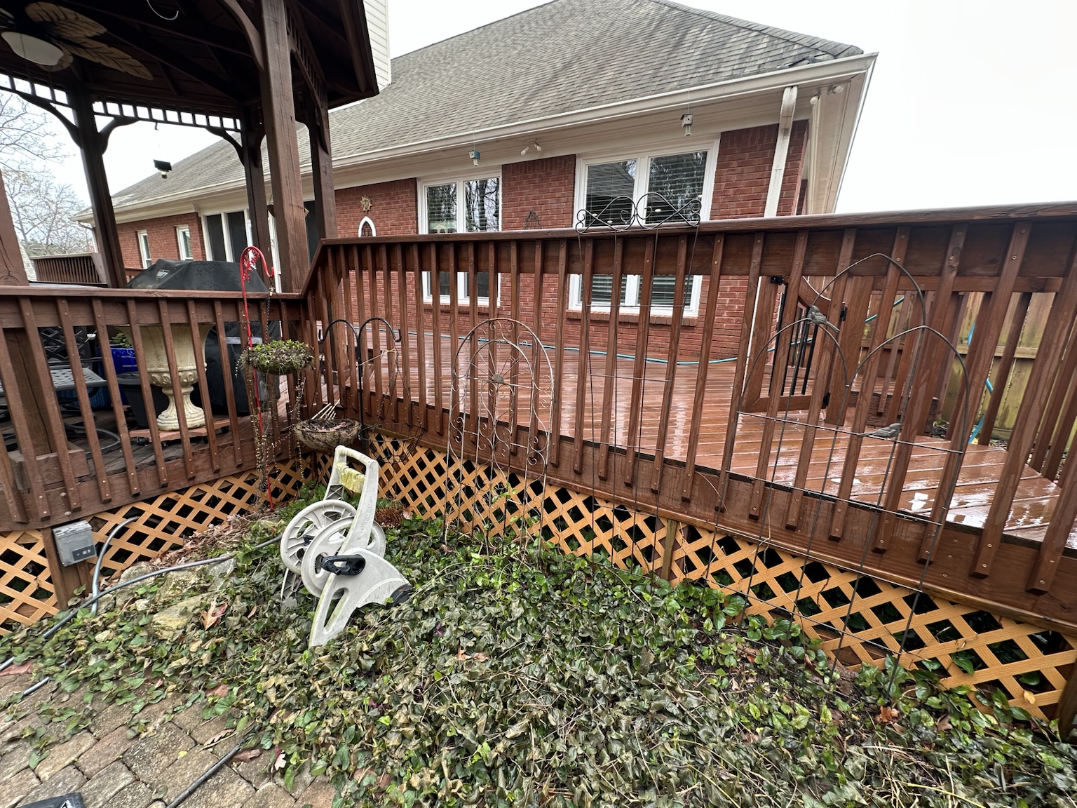 Residential deck and exterior before renovation — view 5