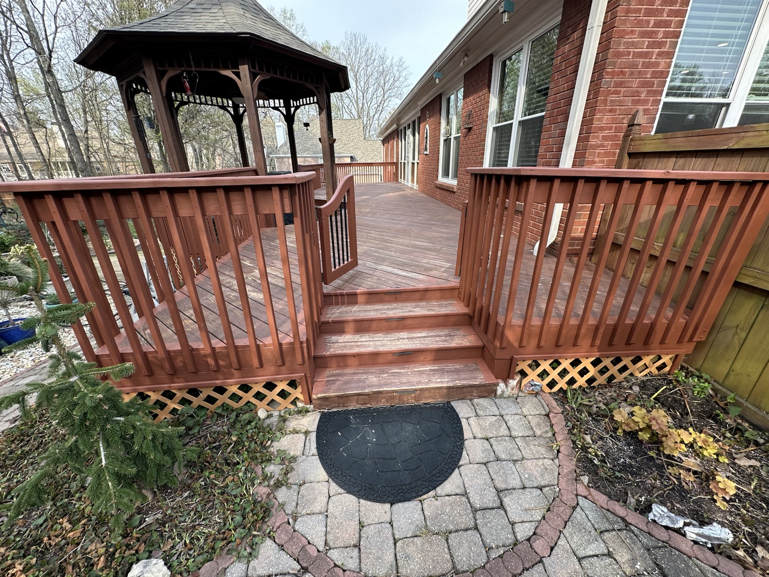 Residential deck and exterior before renovation — view 6